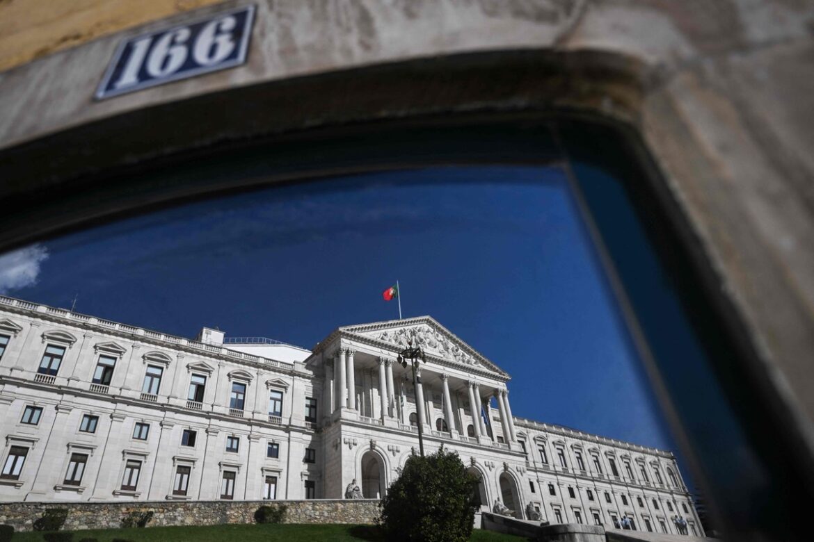 108763501-the-portuguese-parliament-reflects-on-a-window-in-lisbon-on-october-10-2024-the-portuguese.jpg