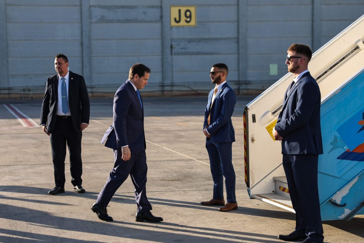 112805707-us-secretary-of-state-marco-rubio-2nd-l-boards-a-plane-as-he-departs-for-doha-from-ben-gur.jpg